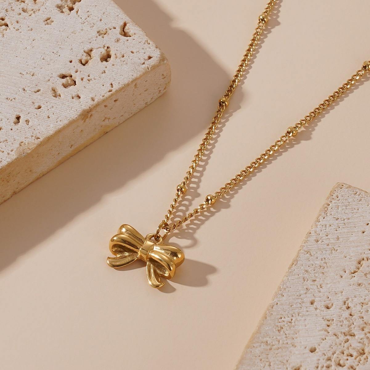 Elegant Gold Bow Pendant Necklace