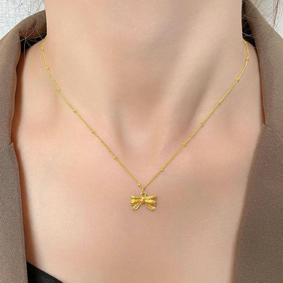 Elegant Gold Bow Pendant Necklace