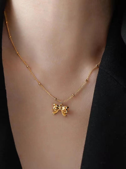 Elegant Gold Bow Pendant Necklace